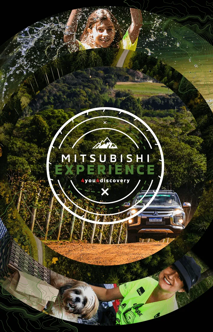 Foto de uma estrada de terra com um veículo da Mitsubishi participando do Mitsubishi Experience